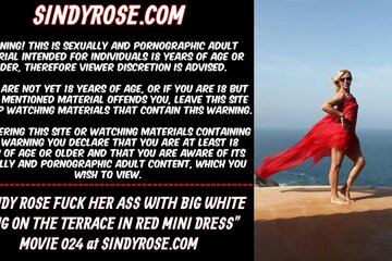 Sindy Rose fuck her ass with white dong on the terrace in red mini dress